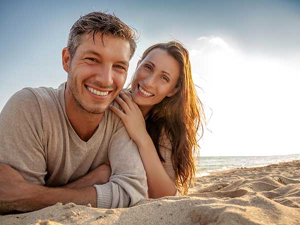 Muture Singles Couple Laying On The Sand